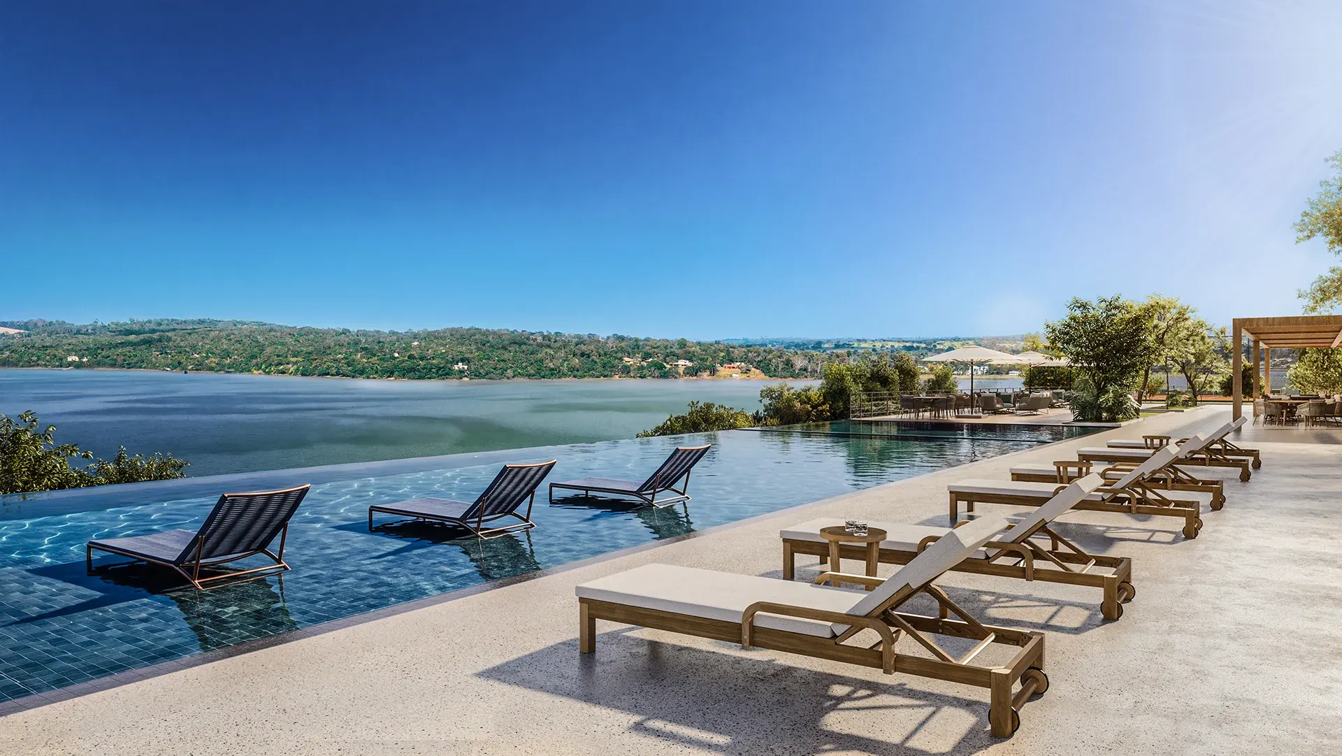 Piscina infinita do beach club com vista para a represa
